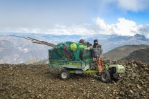 A Grillo tractor loaded with wood, working tools and rucksacks at 4000m above sea level in the Andes, Peru. 